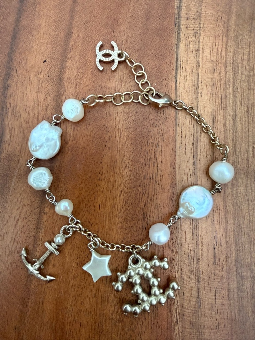 CHANEL Silver Tone Bracelet With Charms and Pearls